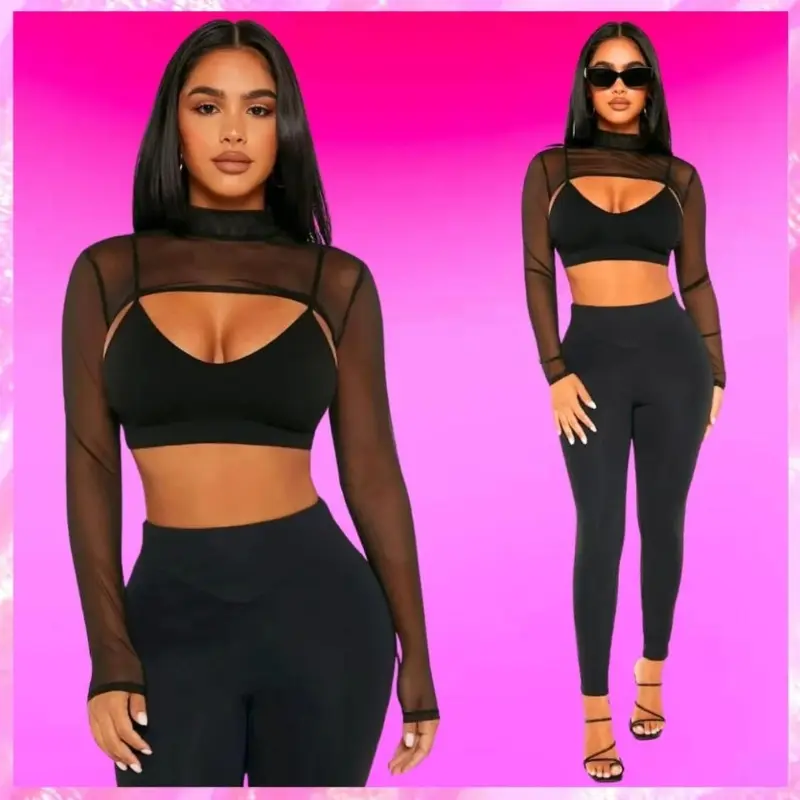 Model wearing a black mesh long sleeve top and black leggings with high heels.