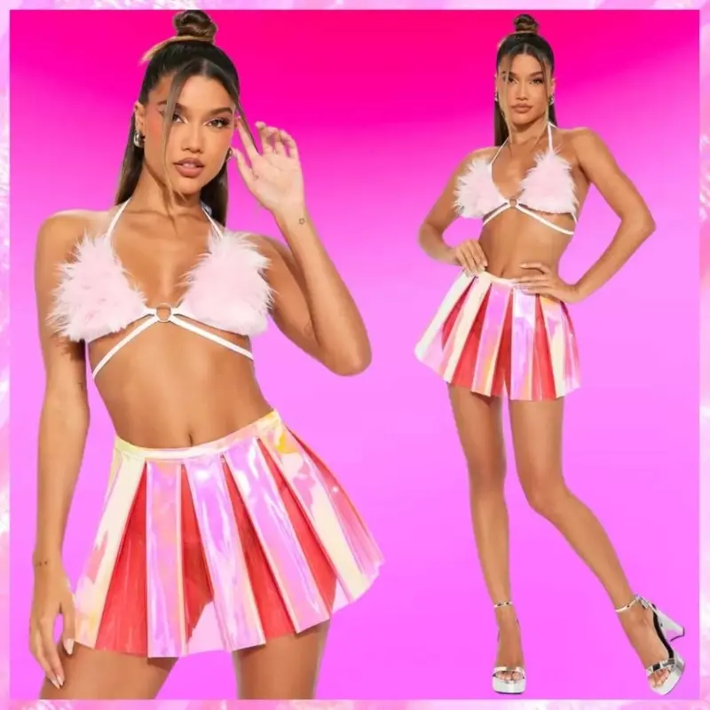 Model wearing a pink and white striped mini skirt and a feathered top against a plain background.