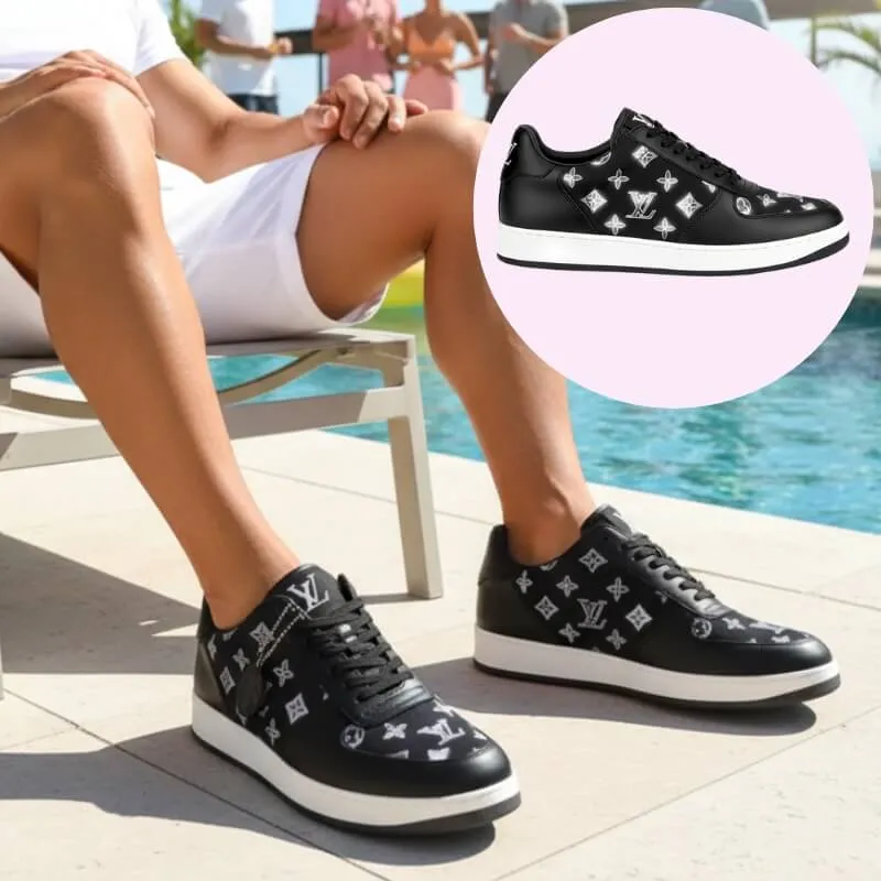 Model wearing monogram pattern low top sneakers in black