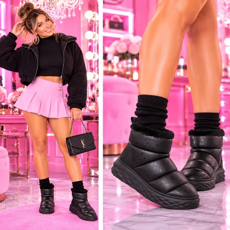 Model wearing women’s cozy slip on winter boots with thick platform soles in black